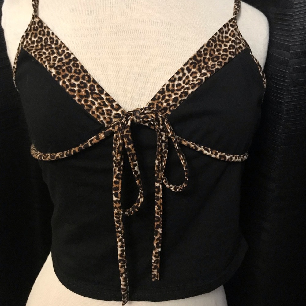 Black spaghetti strap top with leopard trim.
